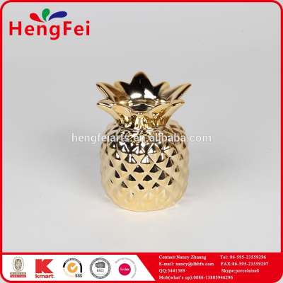 ceramic pineapple shape candle holder with gold finish